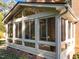 Enclosed sun room featuring large windows, and views of the patio at 5016 Dillswood Ln, Raleigh, NC 27606