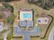 Aerial view featuring the pool, splashpad, parking and playground at 5109 Dove Forest Ln, Apex, NC 27539