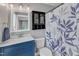 Bathroom featuring a sink with vanity, decorative mirror, and floral shower curtain at 5109 Dove Forest Ln, Apex, NC 27539