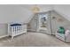 Charming bedroom with a cozy crib, a large window with backyard view, and ample light at 5109 Dove Forest Ln, Apex, NC 27539
