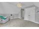 Bedroom featuring a reading chair, overhead lighting, and ample closet space at 5109 Dove Forest Ln, Apex, NC 27539
