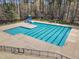Aerial view of a community pool surrounded by fence and mature trees at 5109 Dove Forest Ln, Apex, NC 27539