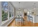 Sun-filled dining room with large windows and adjacent fireplace adds beauty at 5109 Dove Forest Ln, Apex, NC 27539