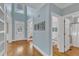 Bright foyer with hardwood floors, high ceilings, and a decorative glass front door at 5109 Dove Forest Ln, Apex, NC 27539