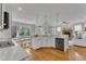 Open kitchen with a modern design, island, stainless steel appliances, and plenty of storage at 5109 Dove Forest Ln, Apex, NC 27539