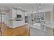 Open concept kitchen features stainless appliances, double oven, and white cabinets at 5109 Dove Forest Ln, Apex, NC 27539