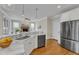 Bright kitchen with stainless appliances, granite countertops, and open layout at 5109 Dove Forest Ln, Apex, NC 27539