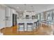 Spacious open kitchen features stainless appliances, kitchen island, and dining area at 5109 Dove Forest Ln, Apex, NC 27539