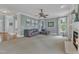 Spacious living room with carpet, a ceiling fan, and lots of natural light at 5109 Dove Forest Ln, Apex, NC 27539