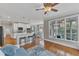View of kitchen and dining areas off the living room with hardwood floors at 5109 Dove Forest Ln, Apex, NC 27539