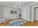 Bright playroom with hardwood floors, stylish light fixture and cozy decor at 5109 Dove Forest Ln, Apex, NC 27539