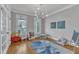 Versatile playroom area filled with lots of natural light, hardwood floors and toys at 5109 Dove Forest Ln, Apex, NC 27539