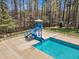 Inviting community pool with slide, surrounded by mature trees at 5109 Dove Forest Ln, Apex, NC 27539