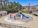 Community splash pad with colorful play structures for hours of fun at 5109 Dove Forest Ln, Apex, NC 27539