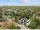 Aerial view showcasing modern townhomes in a lush, green neighborhood with skyline views at 512 Edgecreek Ct, Raleigh, NC 27604