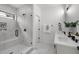 Modern bathroom featuring a glass-enclosed shower and double vanity with matte black fixtures at 512 Edgecreek Ct, Raleigh, NC 27604