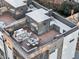 Stunning rooftop deck features modern outdoor furniture, offering a luxurious space for relaxation and entertaining at 512 Edgecreek Ct, Raleigh, NC 27604