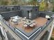 Inviting rooftop deck with stylish outdoor seating and dining area, perfect for entertaining at 513 Edgecreek Ct, Raleigh, NC 27604