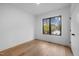 Bright bedroom with hardwood floors and large window offering natural light at 515 Edgecreek Ct, Raleigh, NC 27604
