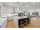 Modern kitchen with island seating flows into a bright living space, ideal for entertaining at 515 Edgecreek Ct, Raleigh, NC 27604