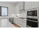 Gourmet kitchen with stainless steel appliances, sleek cabinets, and ample counter space at 515 Edgecreek Ct, Raleigh, NC 27604