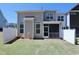 Back of house featuring a screened in porch and a vinyl fence at 547 Historic Dr, Hillsborough, NC 27278