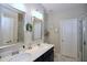 Bathroom featuring a double vanity with modern fixtures, and a walk-in shower with glass doors at 547 Historic Dr, Hillsborough, NC 27278