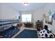 Bright bedroom featuring a bunk bed, a desk by the window and a dark plush rug at 547 Historic Dr, Hillsborough, NC 27278