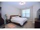 Bedroom featuring a neutral color palette, a large window, and comfortable bedding at 547 Historic Dr, Hillsborough, NC 27278