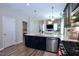 Beautiful kitchen featuring a large island with a breakfast bar, modern countertops, and stainless steel appliances at 547 Historic Dr, Hillsborough, NC 27278