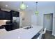 Bright kitchen with a large island, stainless steel appliances, and modern countertops at 547 Historic Dr, Hillsborough, NC 27278