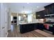 Modern kitchen featuring a large island, stainless steel appliances, and open layout at 547 Historic Dr, Hillsborough, NC 27278