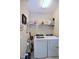 Laundry room featuring a washer, a dryer and wire shelving at 547 Historic Dr, Hillsborough, NC 27278