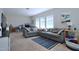Cozy living room with large windows provides lots of natural light for comfort and enjoyment at 547 Historic Dr, Hillsborough, NC 27278