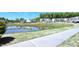 Neighborhood pond surrounded by residential buildings and landscaping at 547 Historic Dr, Hillsborough, NC 27278