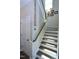 Beautiful staircase with modern wood banister and pristine white risers and stringers at 547 Historic Dr, Hillsborough, NC 27278
