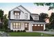 Charming two-story modern farmhouse with a black roof, a well-manicured lawn, and a two car garage at 5491 Silk Hope Gum Springs Rd, Siler City, NC 27344