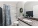 Bathroom with a shower/tub combo and a granite vanity top at 594 Historic Dr, Hillsborough, NC 27278
