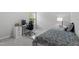 Well-lit bedroom featuring a modern desk and study area near the window at 594 Historic Dr, Hillsborough, NC 27278
