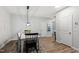 Cozy dining room featuring stylish light fixture and furniture at 594 Historic Dr, Hillsborough, NC 27278