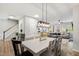 Open-concept dining area with a stylish light fixture and seamless flow to the living spaces at 594 Historic Dr, Hillsborough, NC 27278