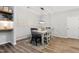 Bright dining room features modern lighting, wood flooring, and decorative wall panels at 594 Historic Dr, Hillsborough, NC 27278