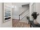 Welcoming entryway with stylish decor, a staircase, and hardwood floors at 594 Historic Dr, Hillsborough, NC 27278