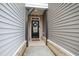 Charming front door with decorative wreath, brick accents, and inviting entrance at 594 Historic Dr, Hillsborough, NC 27278