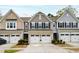 Charming townhome exteriors with well-manicured landscaping at 594 Historic Dr, Hillsborough, NC 27278