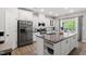 Modern kitchen with granite countertops, stainless steel appliances, and white cabinetry at 594 Historic Dr, Hillsborough, NC 27278
