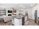 Modern kitchen with granite counters, stainless steel appliances, and open layout at 594 Historic Dr, Hillsborough, NC 27278