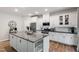 Bright kitchen featuring stainless steel appliances, granite counters, and white cabinetry at 594 Historic Dr, Hillsborough, NC 27278