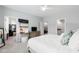 Bright main bedroom with a ceiling fan, ensuite bathroom, and a spacious closet at 594 Historic Dr, Hillsborough, NC 27278
