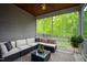 Relaxing screened patio with comfortable seating and views of the lush greenery at 594 Historic Dr, Hillsborough, NC 27278